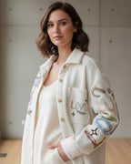 Veste Snoopy blanc cassé touches colorées pilou polyester laine