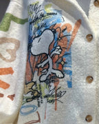 Détail dos veste Snoopy artistique touches colorées bleu orange vert