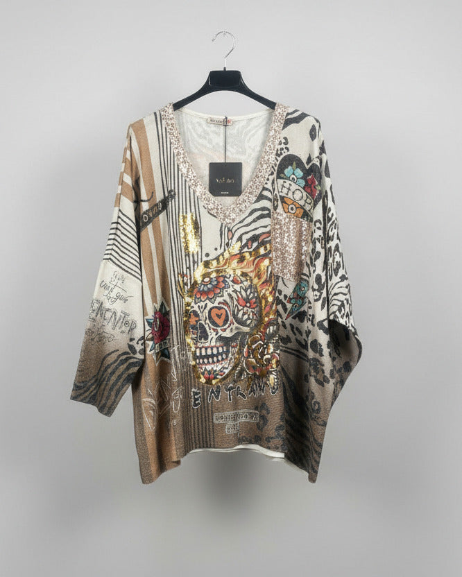 Pull Calavera d'Or tête de mort fleurie dorée – détail col V pailleté
