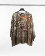 Détail motif tête de mort florale dorée – pull Calavera d'Or
