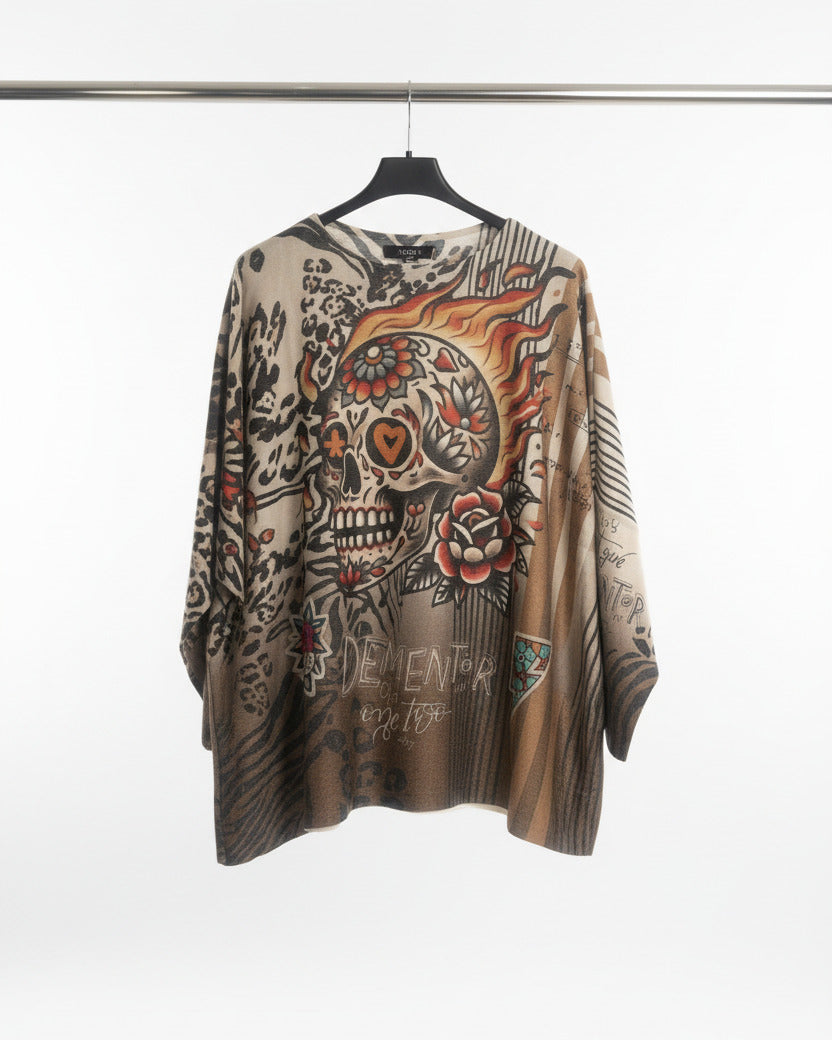 Détail motif tête de mort florale dorée – pull Calavera d'Or
