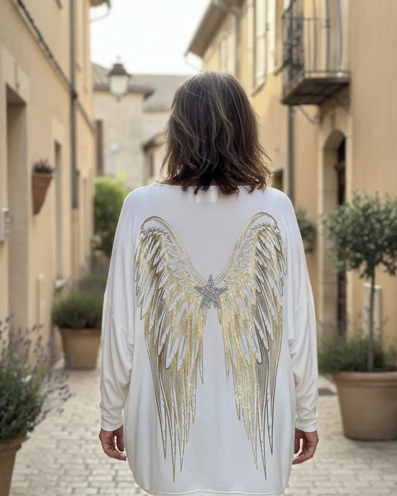 Pull femme oversize blanc orné d’ailes dorées