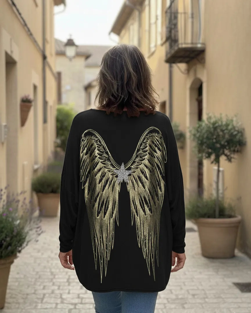Pull femme oversize noir orné d’ailes dorées
