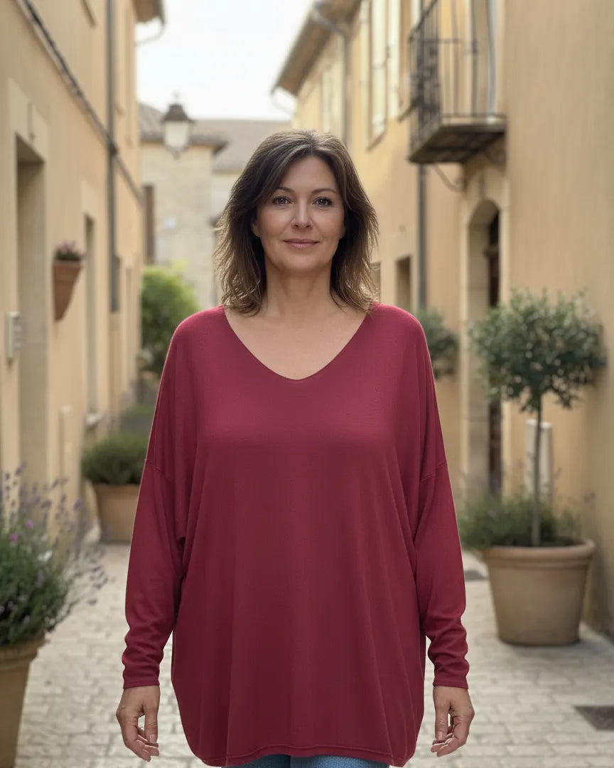 Pull femme oversize bordeaux orné d’ailes dorées