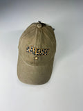 Casquette Râleuse camel délavé avec étoile sous l’inscription, photo boutique.
