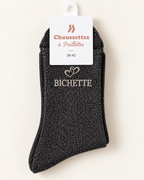 Chaussettes pailletées Bichette noires avec motif cœur sur fond ivoire