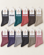 Assortiment de chaussettes pailletées Pétasse en douze coloris sur fond ivoire