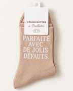 Chaussettes pailletées beiges Parfaite avec de jolis défauts, vue produit sur fond ivoire