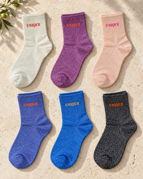 Présentation des six coloris des chaussettes pailletées UNIQUE sur pierre claire