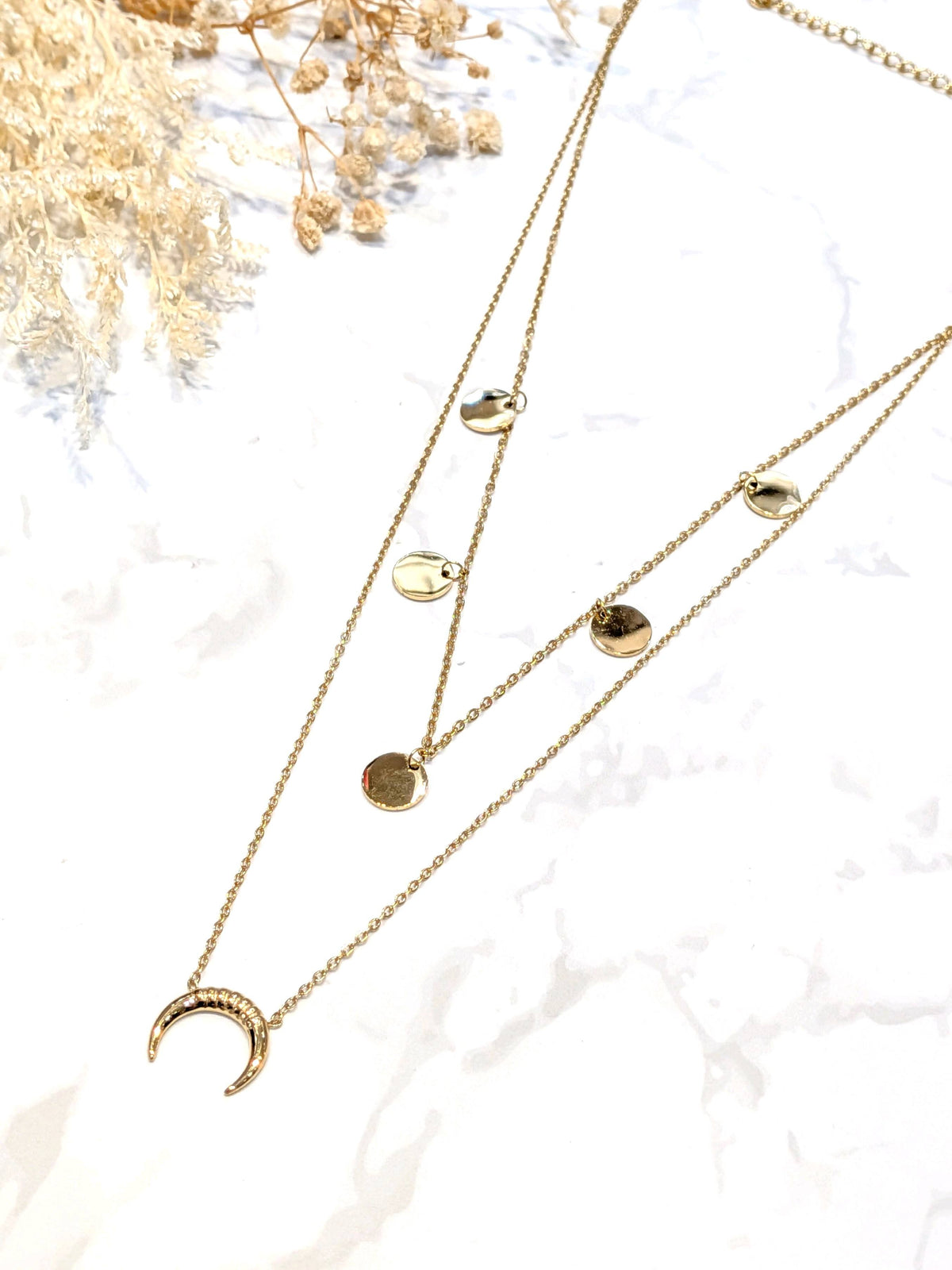 Photo source du collier doré Lune double rang.