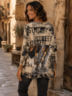 Vue de dos du haut Stella Girl Street beige imprimé porté avec un jean gris dans une ruelle italienne