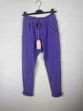 Jogging femme violet en coton extensible avec taille élastique, lien et grandes poches, vue de face