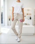 Jogging New York 1989 beige à inscription fuchsia et jambe droite