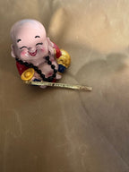 Photo d’origine du jonc doré Une étincelle dans mon cœur, avec une figurine en arrière-plan.