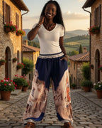 Pantalon Escapade marine à imprimé ruelles porté avec un top blanc