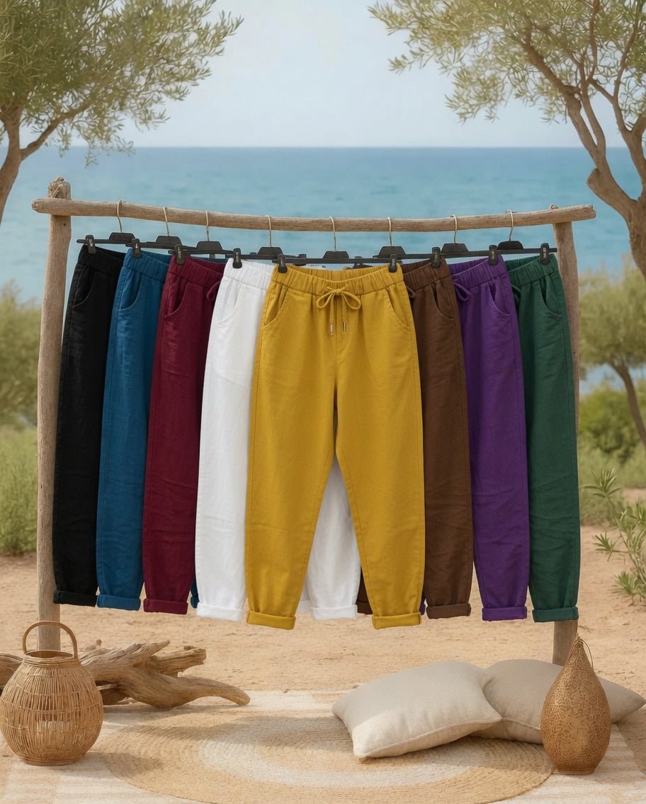 Pantalons Magiques Mam’s Ailes alignés sur un portant, palette de coloris disponibles