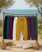 Pantalon Magique femme présenté en plusieurs coloris sur un portant,  ambiance  bord de mer 