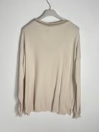 Dos uni du pull Lucia beige, manches longues et finitions côtelées.