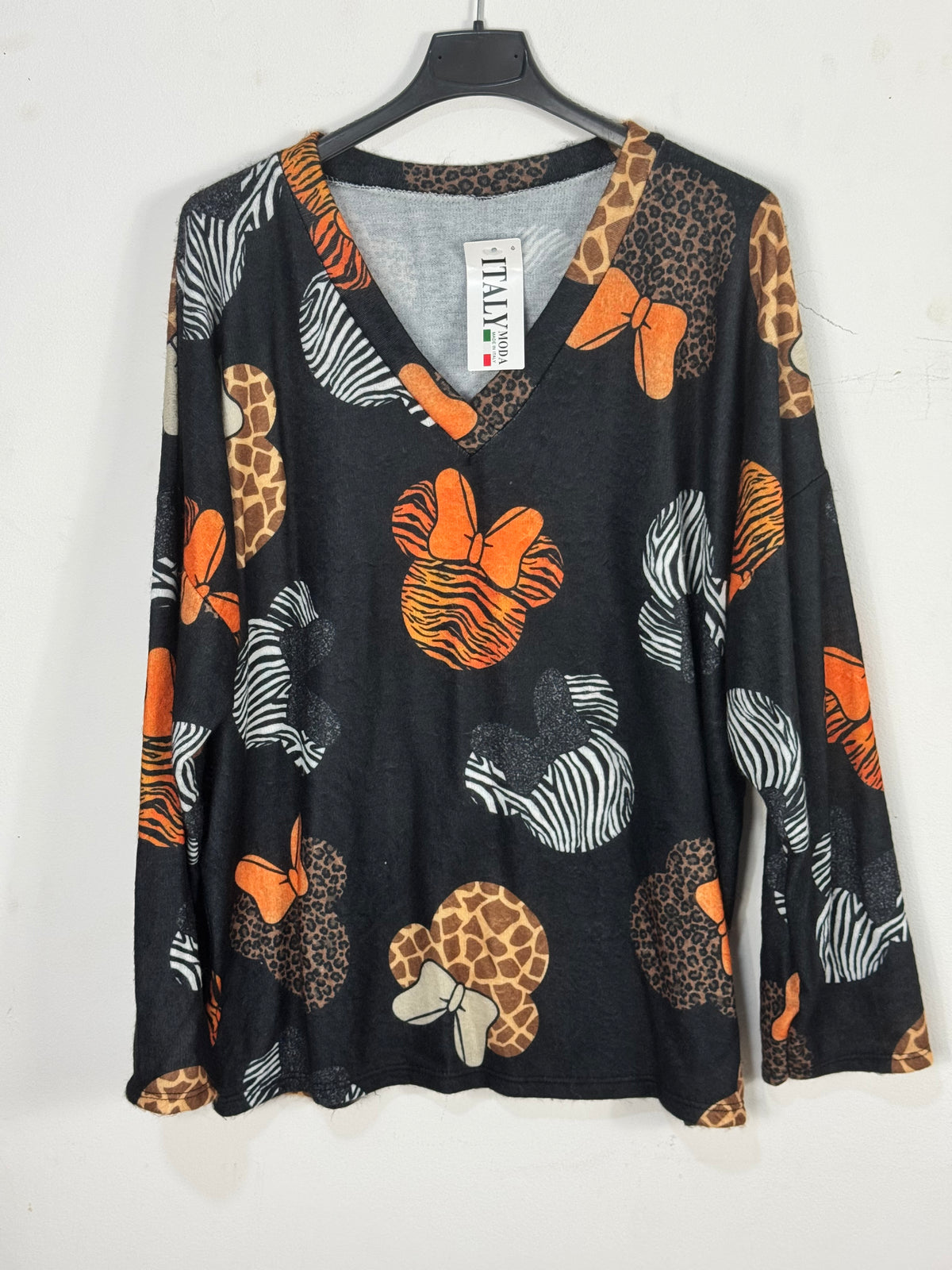 Pull Minnie, noir de face, col V — photo du produit.
