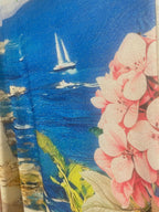 Détail du tissu lurex irisé doré de la robe longue Capri, composition viscose polyester élasthanne