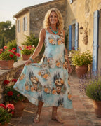 Robe longue Frida Azura femme imprimé bleu aqua avec fleurs et portrait artistique, vue de face, fluide
