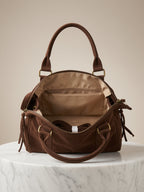 Intérieur sac suède chocolat – doublure beige motif étoile – poche intérieure – sangle amovible – dimensions 35x25x14