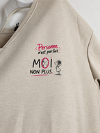 Détail du message Personne n’est parfait… Moi non plus et du dessin de miroir, photo retouchée.