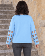 Dos uni du sweat Crâne Fleuri bleu ciel et bandes ajourées des manches