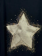 Détail de l’étoile dorée et des strass du Sweat Luce noir