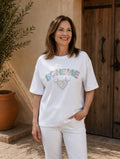 Tee-shirt Bohème femme blanc avec inscription en strass et cœur sur le devant, coupe ample, vue de face