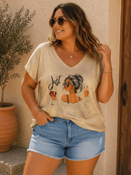 Tee-shirt Luma avec imprimé femme à lunettes tenant un verre, tissu irisé doré et coupe fluide