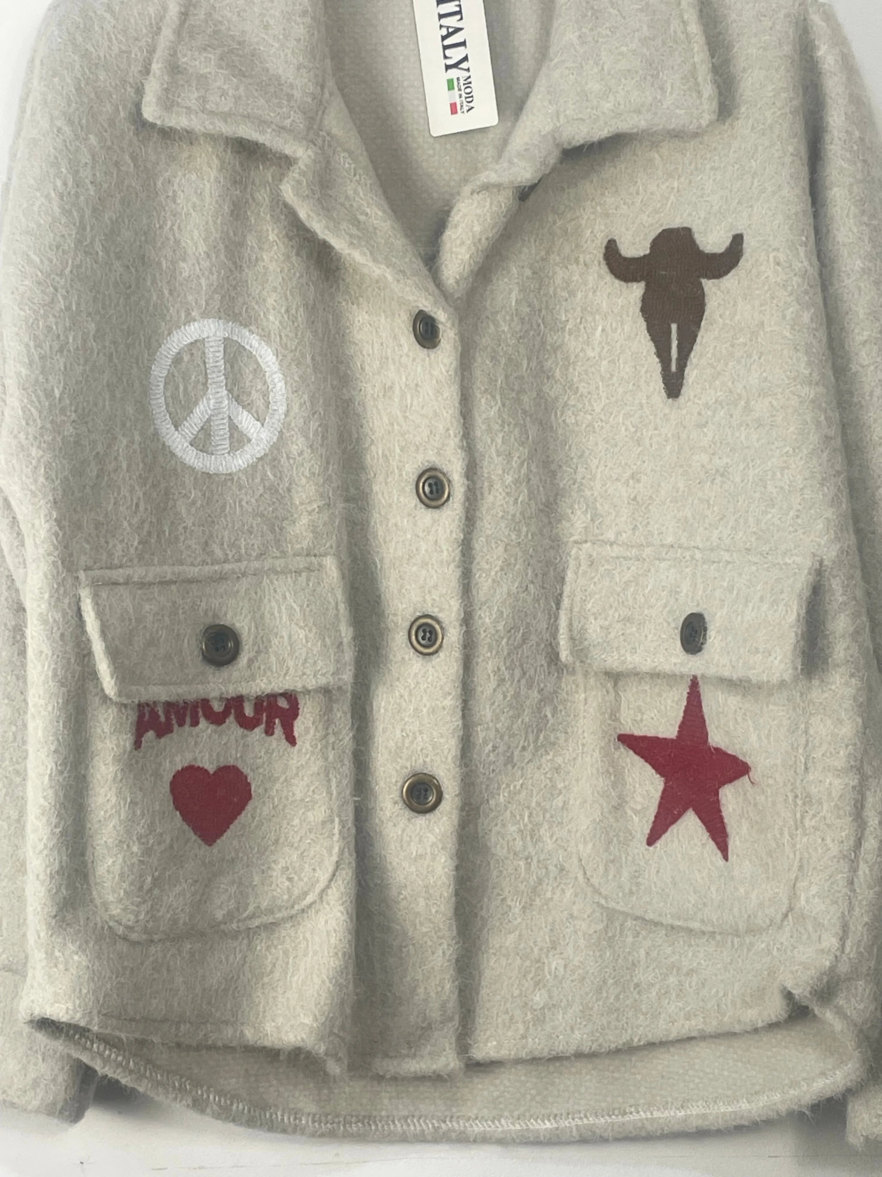 Veste coupe courte avec poches et badges detail